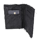 object dyed matte black reverse horse culatta leather cardholder, hand stitched over an 18 hour period without the use of machines. the leather bifold card case features multiple card slots, and a french linen lining. an open seam construction is hand stitched in a japanese linen thread. the wallet is available to buy online from avant garde leather studio atelierskn.com
