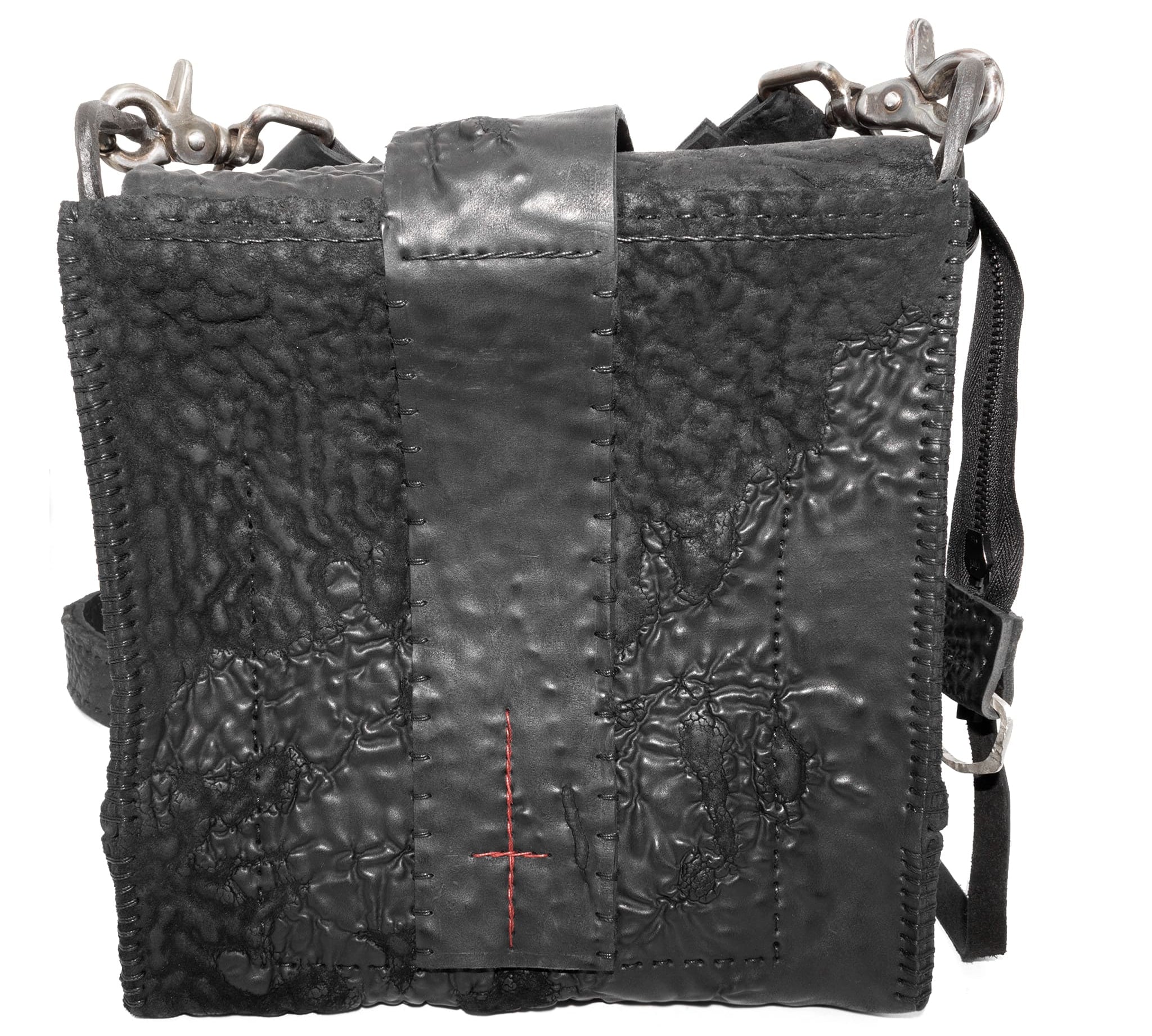 a mini box bag patterned from a full grain reverse horse culatta leather and hand stitched with a japanese linen thread without the use of machines. the bag features a riri zipper closure, double layer hand stitched detachable shoulder strap and hand forged iron and .925 sterling silver hardware. the interior pocket is adorned with a riri zipper and solid .925 sterling silver zipper pull. available from avant garde leather studio atelierskn.com