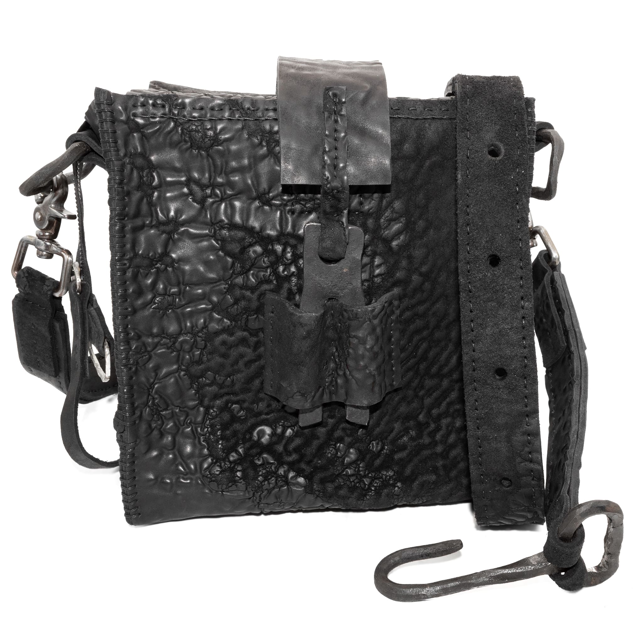 a mini box bag patterned from a full grain reverse horse culatta leather and hand stitched with a japanese linen thread without the use of machines. the bag features a riri zipper closure, double layer hand stitched detachable shoulder strap and hand forged iron and .925 sterling silver hardware. the interior pocket is adorned with a riri zipper and solid .925 sterling silver zipper pull. available from avant garde leather studio atelierskn.com