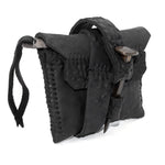 a zipper pocket cardholder crafted from a butter soft reverse horse culatta leather with a matte black object dyed finish in a single piece pattern construction. a riri zipper pocket is adorned with a hand forged solid .925sterling silver zipper pull, which compliments the hand forged solid bronze nail closure, available to buy online from artisanal leather studio atelierskn.com