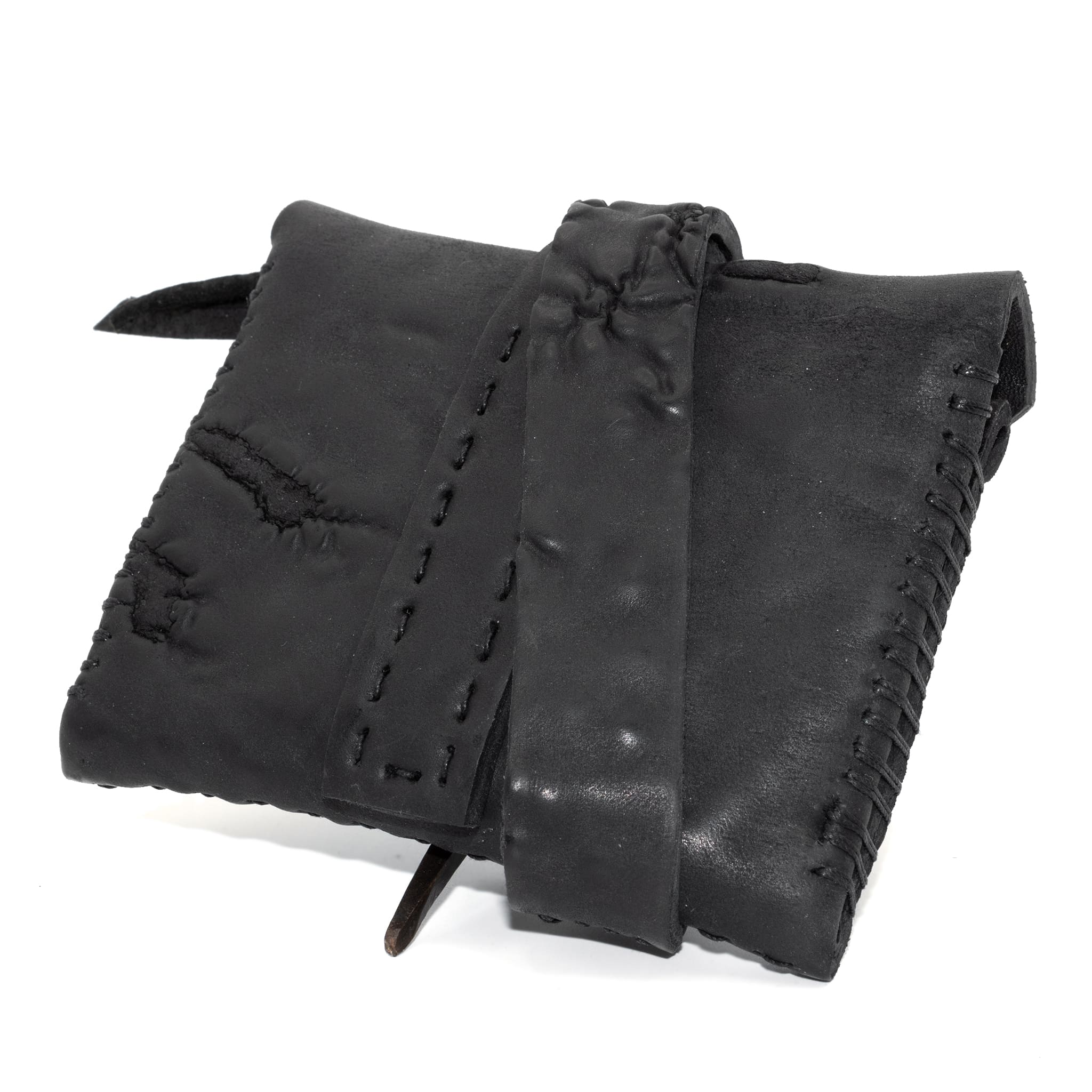 a zipper pocket cardholder crafted from a butter soft reverse horse culatta leather with a matte black object dyed finish in a single piece pattern construction. a riri zipper pocket is adorned with a hand forged solid .925sterling silver zipper pull, which compliments the hand forged solid bronze nail closure, available to buy online from artisanal leather studio atelierskn.com