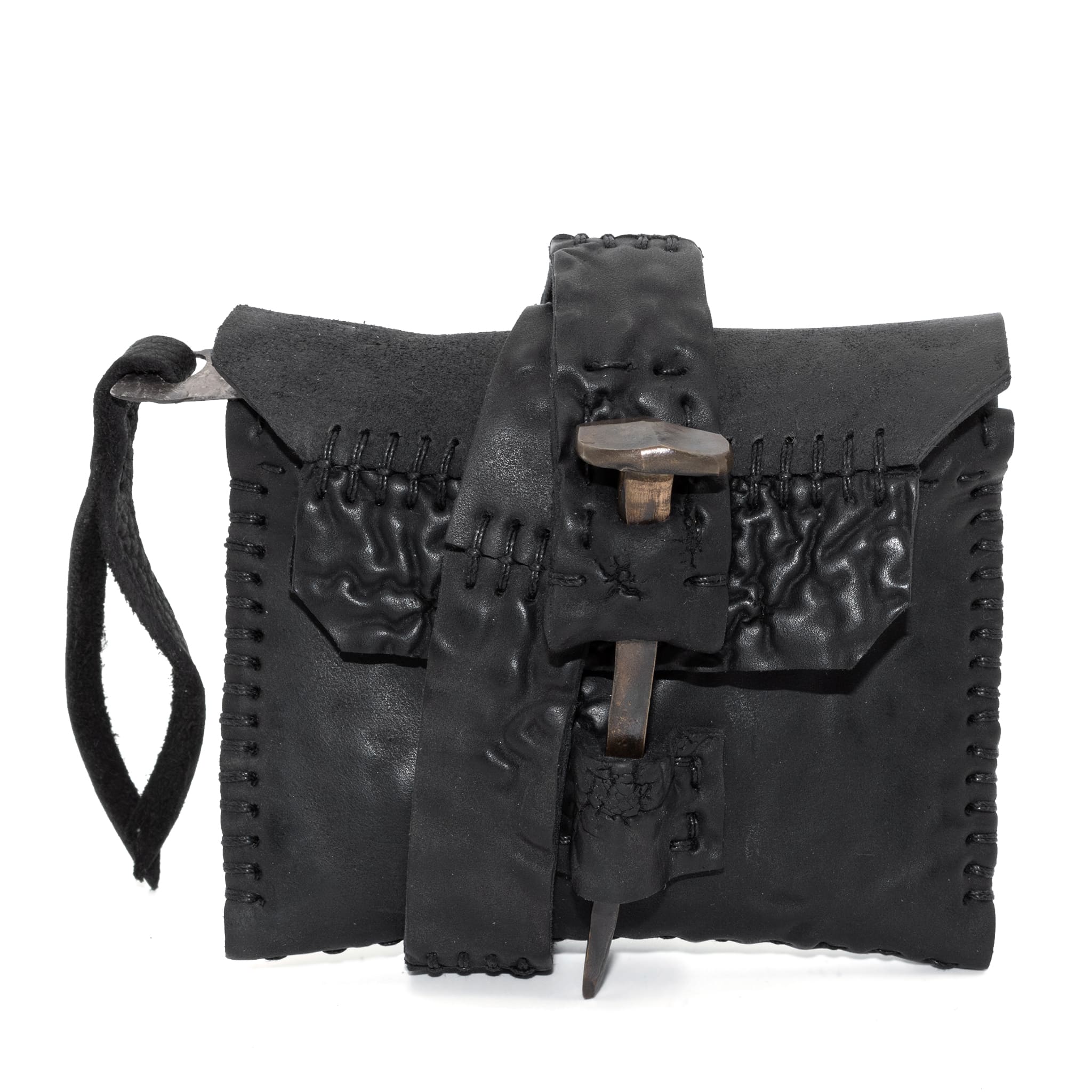 a zipper pocket cardholder crafted from a butter soft reverse horse culatta leather with a matte black object dyed finish in a single piece pattern construction. a riri zipper pocket is adorned with a hand forged solid .925sterling silver zipper pull, which compliments the hand forged solid bronze nail closure, available to buy online from artisanal leather studio atelierskn.com