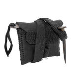 a zipper pocket cardholder crafted from a butter soft reverse horse culatta leather with a matte black object dyed finish in a single piece pattern construction. a riri zipper pocket is adorned with a hand forged solid .925sterling silver zipper pull, which compliments the hand forged solid bronze nail closure, available to buy online from artisanal leather studio atelierskn.com