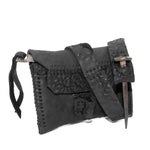 a zipper pocket cardholder crafted from a butter soft reverse horse culatta leather with a matte black object dyed finish in a single piece pattern construction. a riri zipper pocket is adorned with a hand forged solid .925sterling silver zipper pull, which compliments the hand forged solid bronze nail closure, available to buy online from artisanal leather studio atelierskn.com