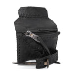 a zipper pocket cardholder crafted from a butter soft reverse horse culatta leather with a matte black object dyed finish in a single piece pattern construction. a riri zipper pocket is adorned with a hand forged solid .925sterling silver zipper pull, which compliments the hand forged solid bronze nail closure, available to buy online from artisanal leather studio atelierskn.com