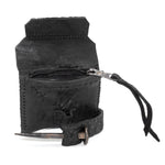 a zipper pocket cardholder crafted from a butter soft reverse horse culatta leather with a matte black object dyed finish in a single piece pattern construction. a riri zipper pocket is adorned with a hand forged solid .925sterling silver zipper pull, which compliments the hand forged solid bronze nail closure, available to buy online from artisanal leather studio atelierskn.com