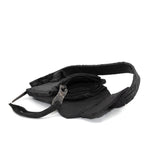 a zipper pocket cardholder crafted from a butter soft reverse horse culatta leather with a matte black object dyed finish in a single piece pattern construction. a riri zipper pocket is adorned with a hand forged solid .925sterling silver zipper pull, which compliments the hand forged solid bronze nail closure, available to buy online from artisanal leather studio atelierskn.com