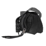 a zipper pocket cardholder crafted from a butter soft reverse horse culatta leather with a matte black object dyed finish in a single piece pattern construction. a riri zipper pocket is adorned with a hand forged solid .925sterling silver zipper pull, which compliments the hand forged solid bronze nail closure, available to buy online from artisanal leather studio atelierskn.com