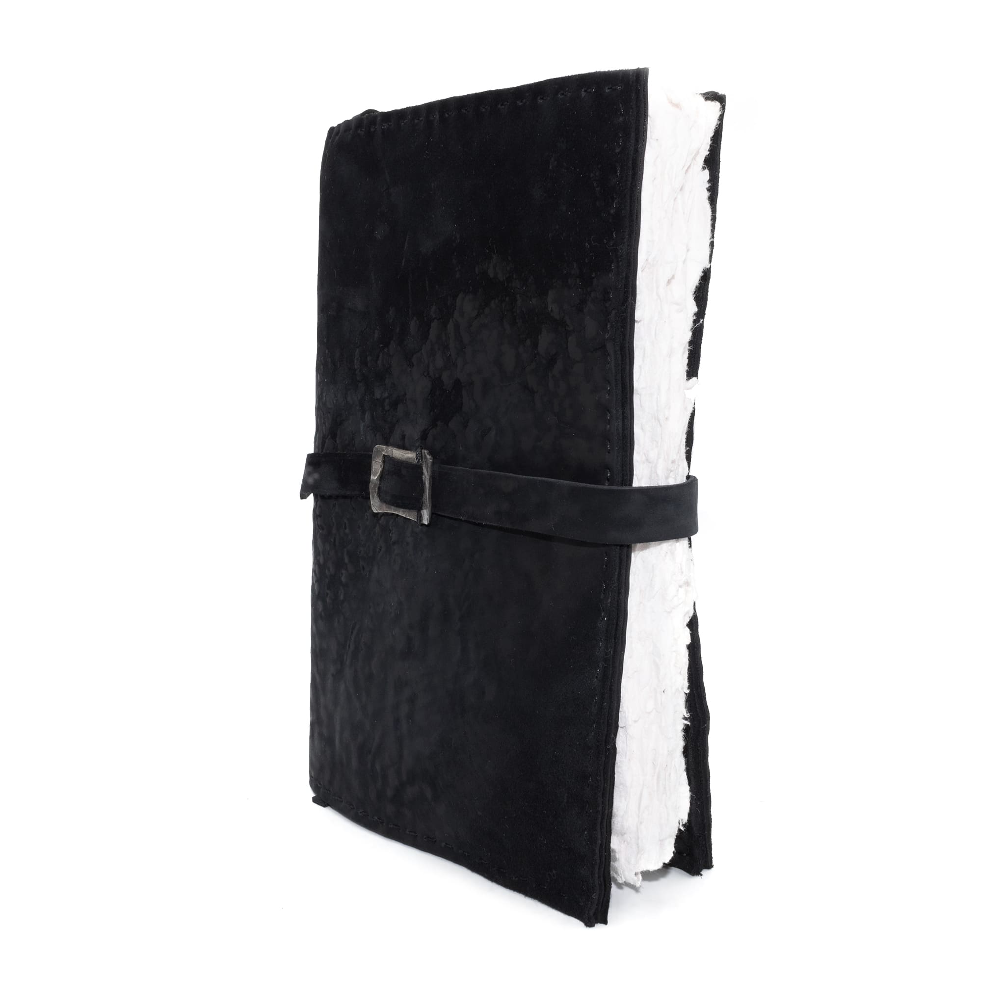 Hand stitched matte black reverse horse culatta leather journal cover with a hand forged solid .925 sterling silver buckle closure and multiple pages of 150gsm handmade cotton rag paper. available to buy online from artisanal uk based leather studio atelier skn.