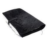 Hand stitched matte black reverse horse culatta leather journal cover with a hand forged solid .925 sterling silver buckle closure and multiple pages of 150gsm handmade cotton rag paper. available to buy online from artisanal uk based leather studio atelier skn.