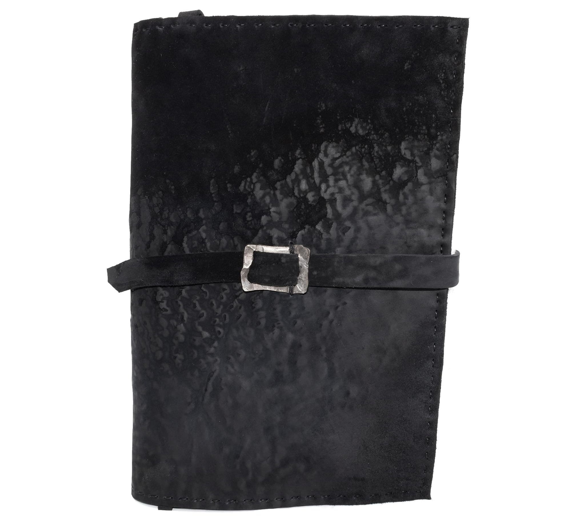 Hand stitched matte black reverse horse culatta leather journal cover with a hand forged solid .925 sterling silver buckle closure and multiple pages of 150gsm handmade cotton rag paper. available to buy online from artisanal uk based leather studio atelier skn.