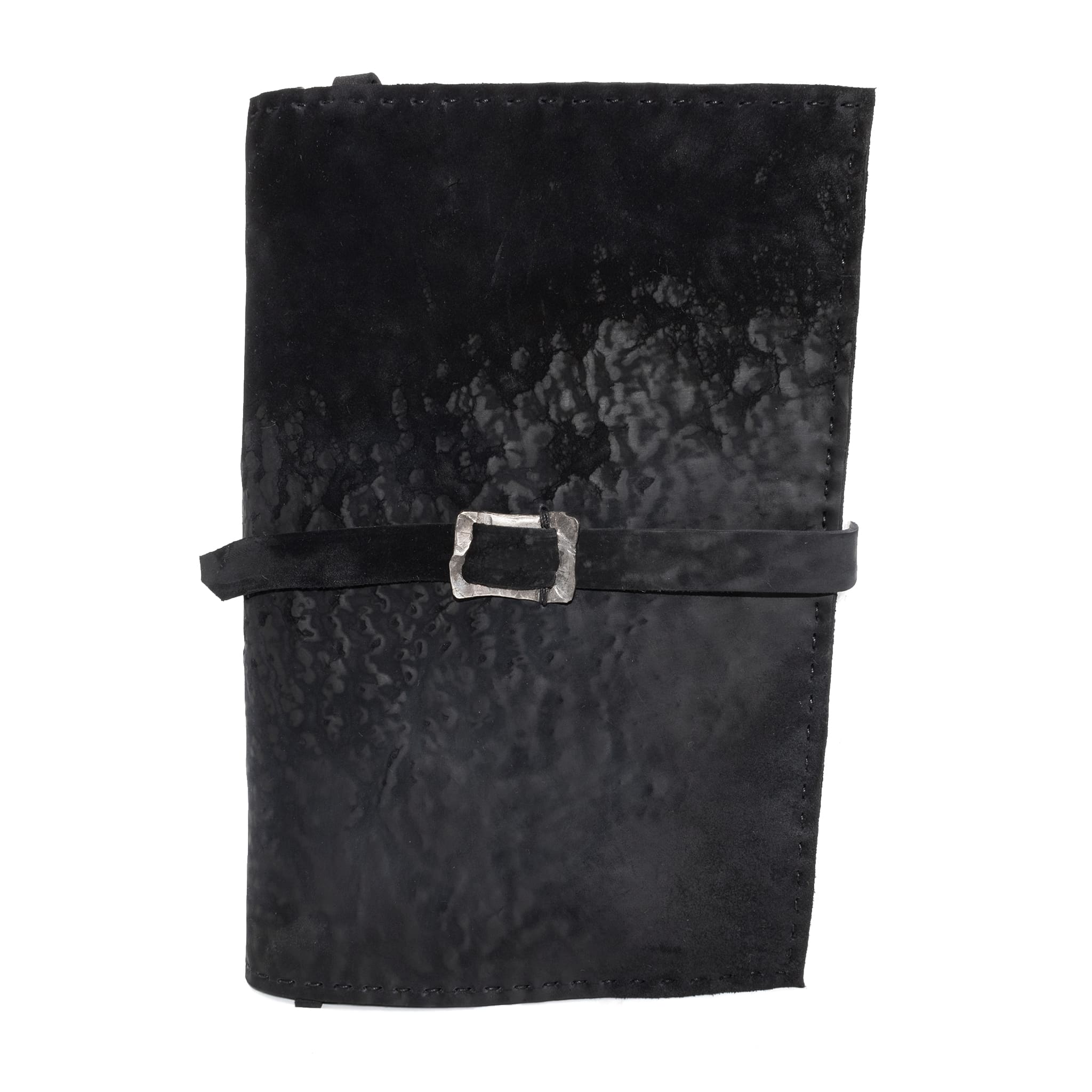 Hand stitched matte black reverse horse culatta leather journal cover with a hand forged solid .925 sterling silver buckle closure and multiple pages of 150gsm handmade cotton rag paper. available to buy online from artisanal uk based leather studio atelier skn.