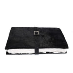 Hand stitched matte black reverse horse culatta leather journal cover with a hand forged solid .925 sterling silver buckle closure and multiple pages of 150gsm handmade cotton rag paper. available to buy online from artisanal uk based leather studio atelier skn.