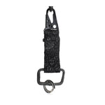 hand stitched and hand dyed reverse horse culatta leather keychain adorned with hand forged iron and .925 sterling silver hardware. a distressed military clip and overlock stitching finish off the keychain. available online from artisanal leather studio atelier skn.