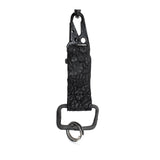 hand stitched and hand dyed reverse horse culatta leather keychain adorned with hand forged iron and .925 sterling silver hardware. a distressed military clip and overlock stitching finish off the keychain. available online from artisanal leather studio atelier skn.