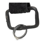 hand stitched and hand dyed reverse horse culatta leather keychain adorned with hand forged iron and .925 sterling silver hardware. a distressed military clip and overlock stitching finish off the keychain. available online from artisanal leather studio atelier skn.