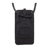 meticulously hand stitched, the washed reverse horse culatta leather phone case features a minimal silhouette, with a distressed iron dye treatment, tonal linen stitching and a card slot to the rear. the phone holder is available to buy online from avant garde designer atelierskn.com 