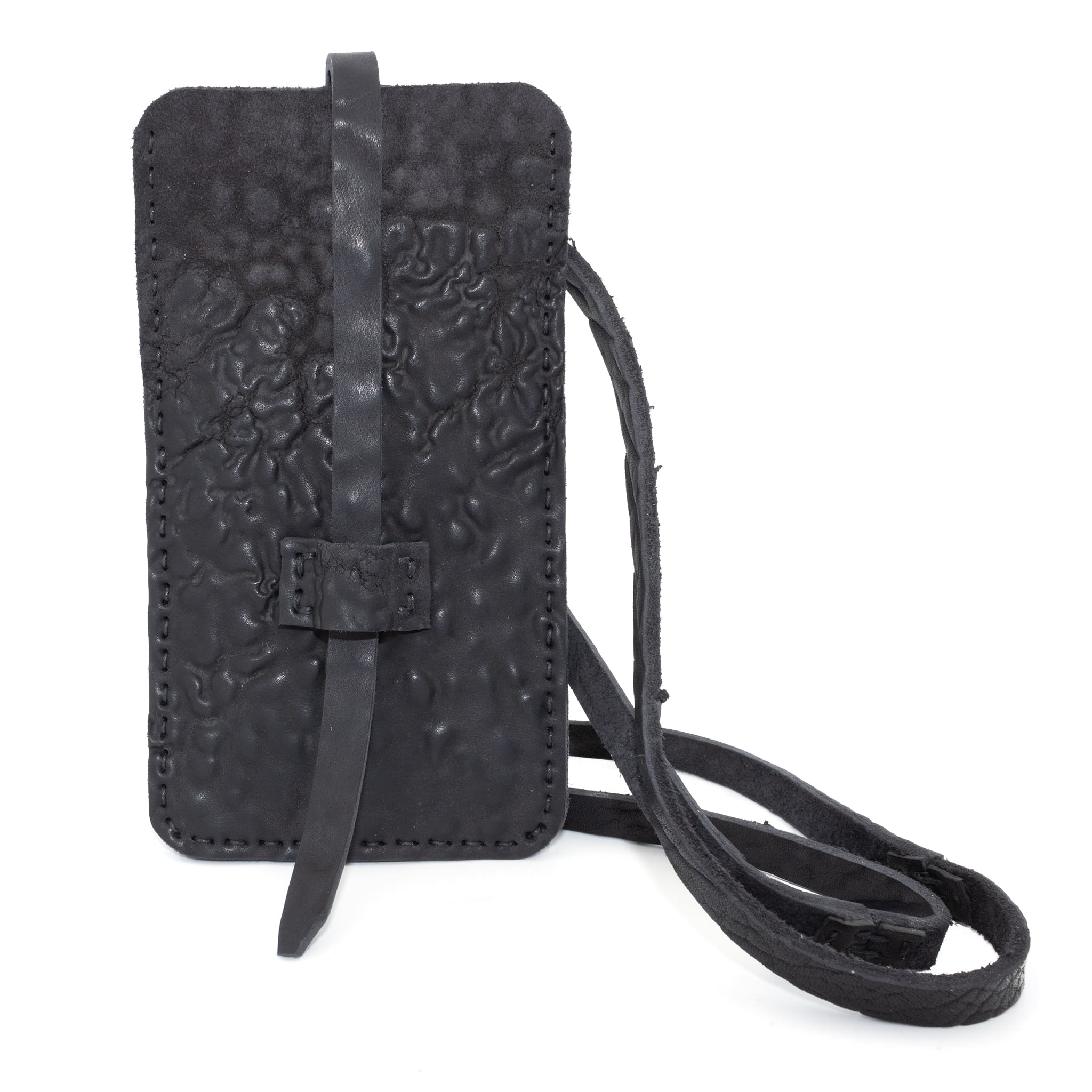 meticulously hand stitched, the washed reverse horse culatta leather phone case features a minimal silhouette, with a distressed iron dye treatment, tonal linen stitching and a card slot to the rear. the phone holder is available to buy online from avant garde designer atelierskn.com 