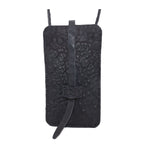 meticulously hand stitched, the washed reverse horse culatta leather phone case features a minimal silhouette, with a distressed iron dye treatment, tonal linen stitching and a card slot to the rear. the phone holder is available to buy online from avant garde designer atelierskn.com 