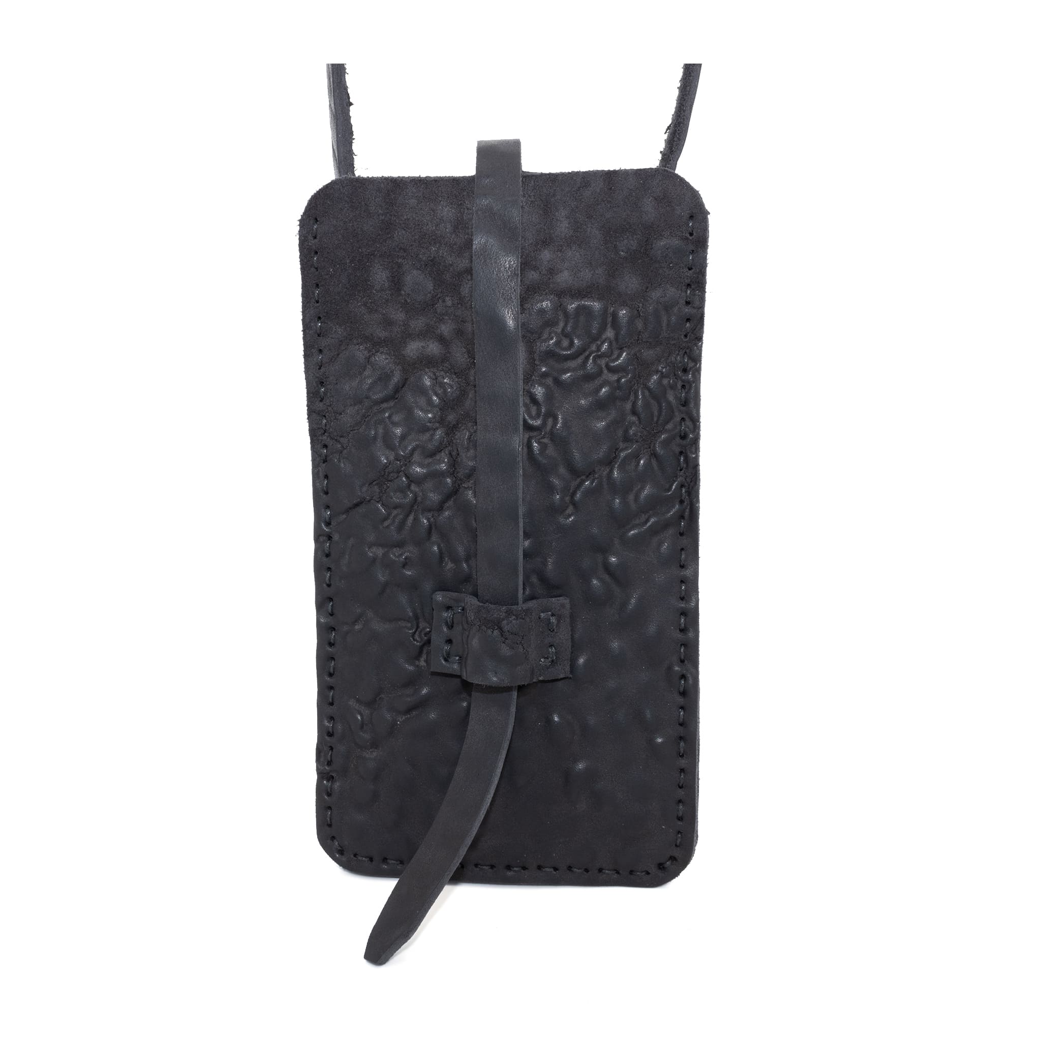 meticulously hand stitched, the washed reverse horse culatta leather phone case features a minimal silhouette, with a distressed iron dye treatment, tonal linen stitching and a card slot to the rear. the phone holder is available to buy online from avant garde designer atelierskn.com 