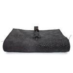 Hand stitched object dyed grey reverse horse culatta leather journal cover with a hand forged solid burnt bronze nail closure, interior pockets and multiple pages of 150gsm handmade cotton rag paper. available to buy online from artisanal uk based leather studio atelier skn.