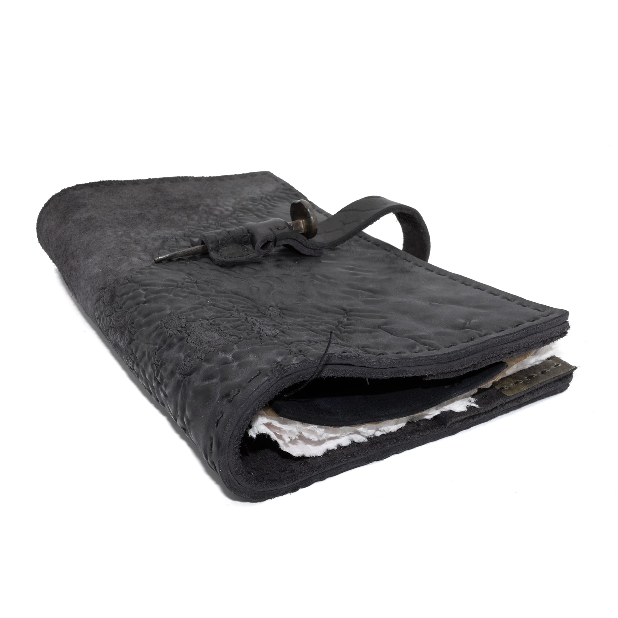 Hand stitched object dyed grey reverse horse culatta leather journal cover with a hand forged solid burnt bronze nail closure, interior pockets and multiple pages of 150gsm handmade cotton rag paper. available to buy online from artisanal uk based leather studio atelier skn.