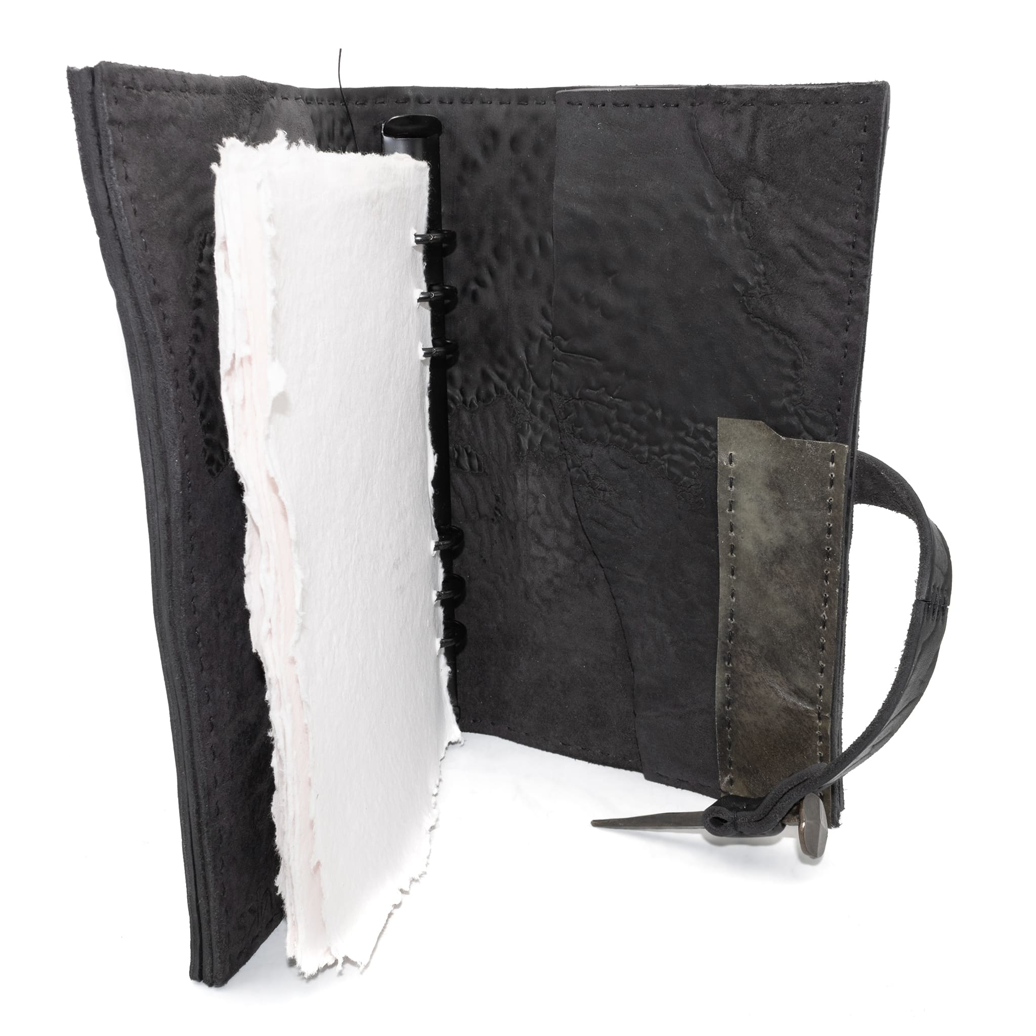 Hand stitched object dyed grey reverse horse culatta leather journal cover with a hand forged solid burnt bronze nail closure, interior pockets and multiple pages of 150gsm handmade cotton rag paper. available to buy online from artisanal uk based leather studio atelier skn.