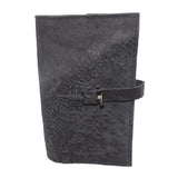 Hand stitched object dyed grey reverse horse culatta leather journal cover with a hand forged solid burnt bronze nail closure, interior pockets and multiple pages of 150gsm handmade cotton rag paper. available to buy online from artisanal uk based leather studio atelier skn.