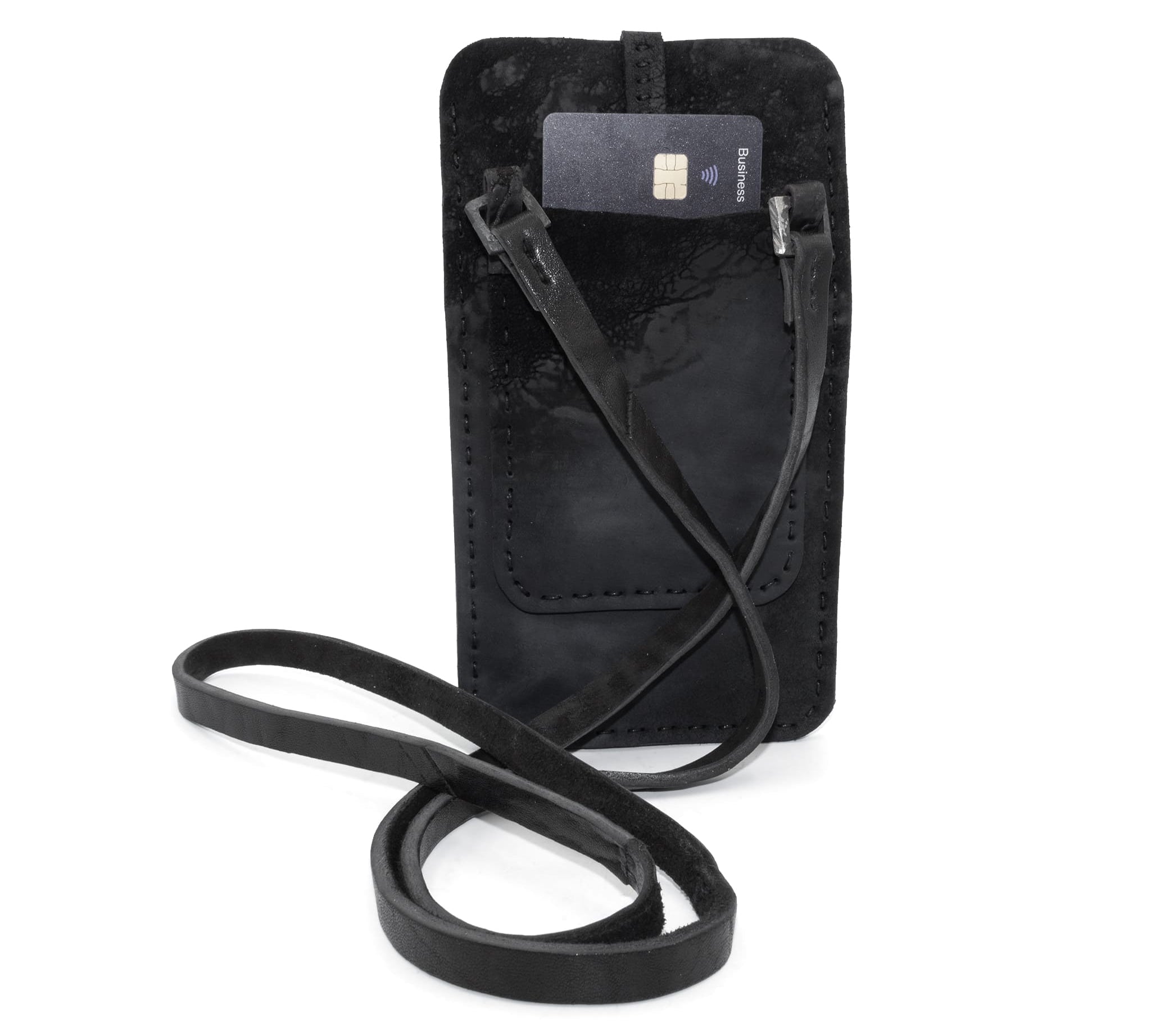 meticulously hand stitched, the washed reverse horse culatta leather phone case features a minimal silhouette, a distressed black dye treatment, tonal linen stitching and hand forged .925 sterling silver details. the phone holder is available to buy online from avant garde designer atelierskn.com 