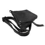 the sling bag is  patterned from a full grain reverse horse culatta leather and hand stitched with a japanese linen thread without the use of machines. the bag features a riri zipper closure, double layer hand stitched shoulder strap and hand forged iron and .925 sterling silver hardware. the rear pocket is linen with a french linen and adorned with a riri zipper and solid .925 sterling silver zipper pull. available from avant garde leather studio atelierskn.com