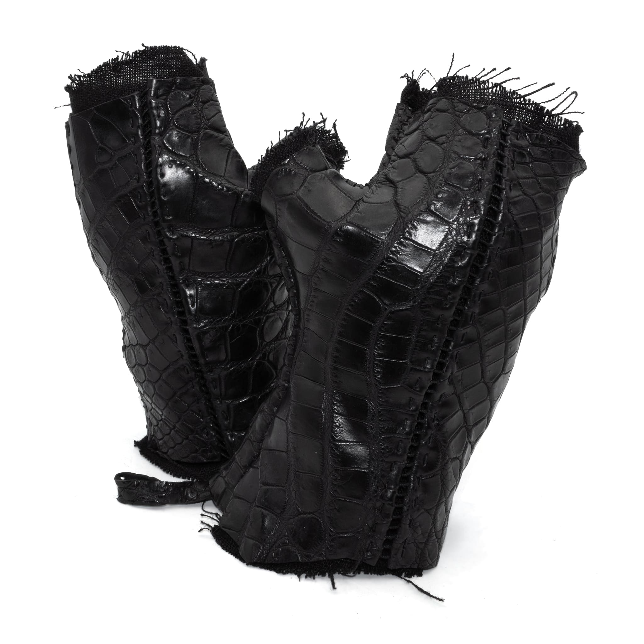 hand stitched over a 40hr period the genuine crocodile leather gloves feature deconstructed open seam panels, and a raw cut vintage french linen lining. with an object dyed finish the gloves are then wet moulded on the body over an 8 hour period for a sculptured aesthetic. the gloves are available to buy online from avant garde leather studio atelierskn.com