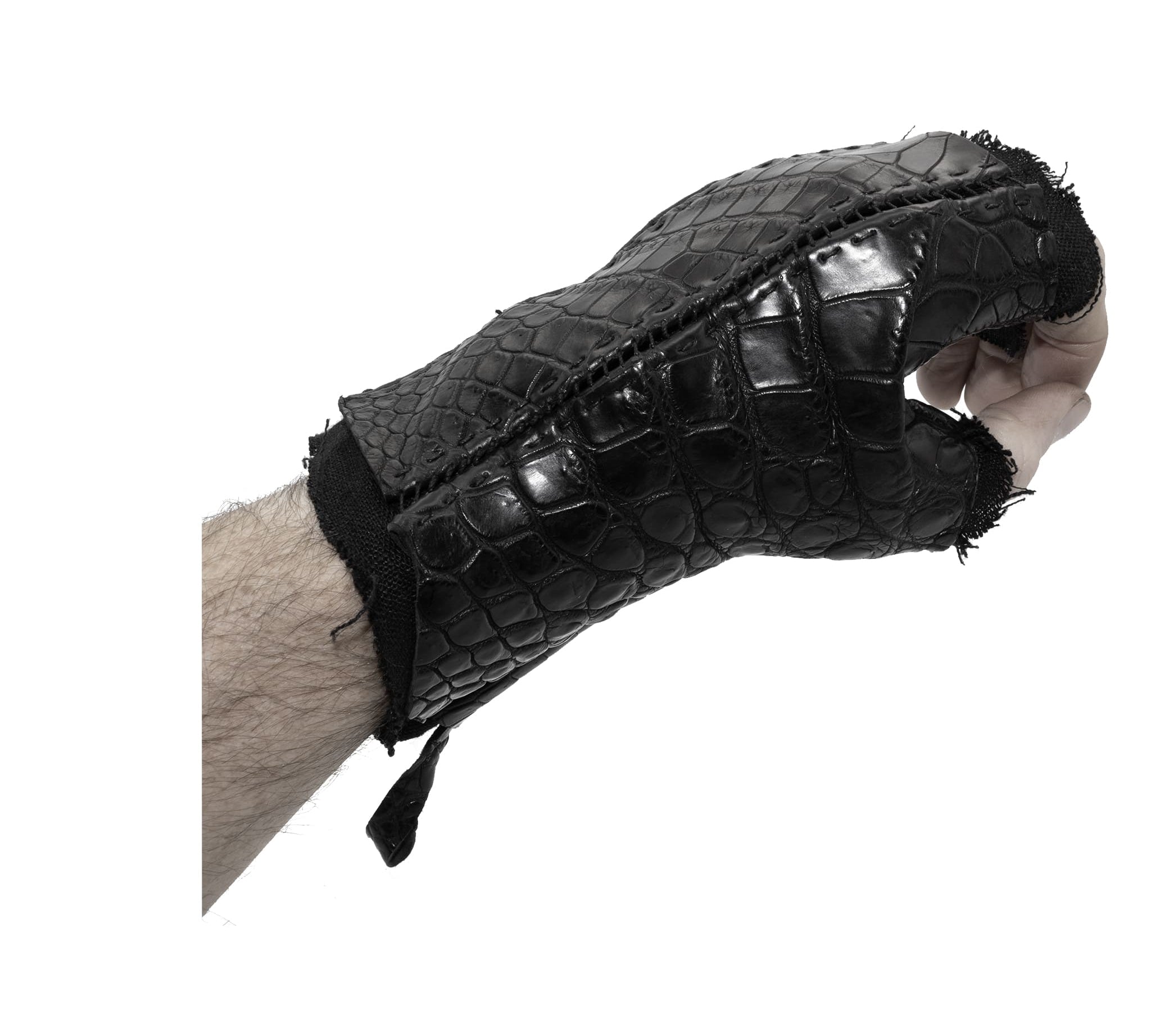 hand stitched over a 40hr period the genuine crocodile leather gloves feature deconstructed open seam panels, and a raw cut vintage french linen lining. with an object dyed finish the gloves are then wet moulded on the body over an 8 hour period for a sculptured aesthetic. the gloves are available to buy online from avant garde leather studio atelierskn.com