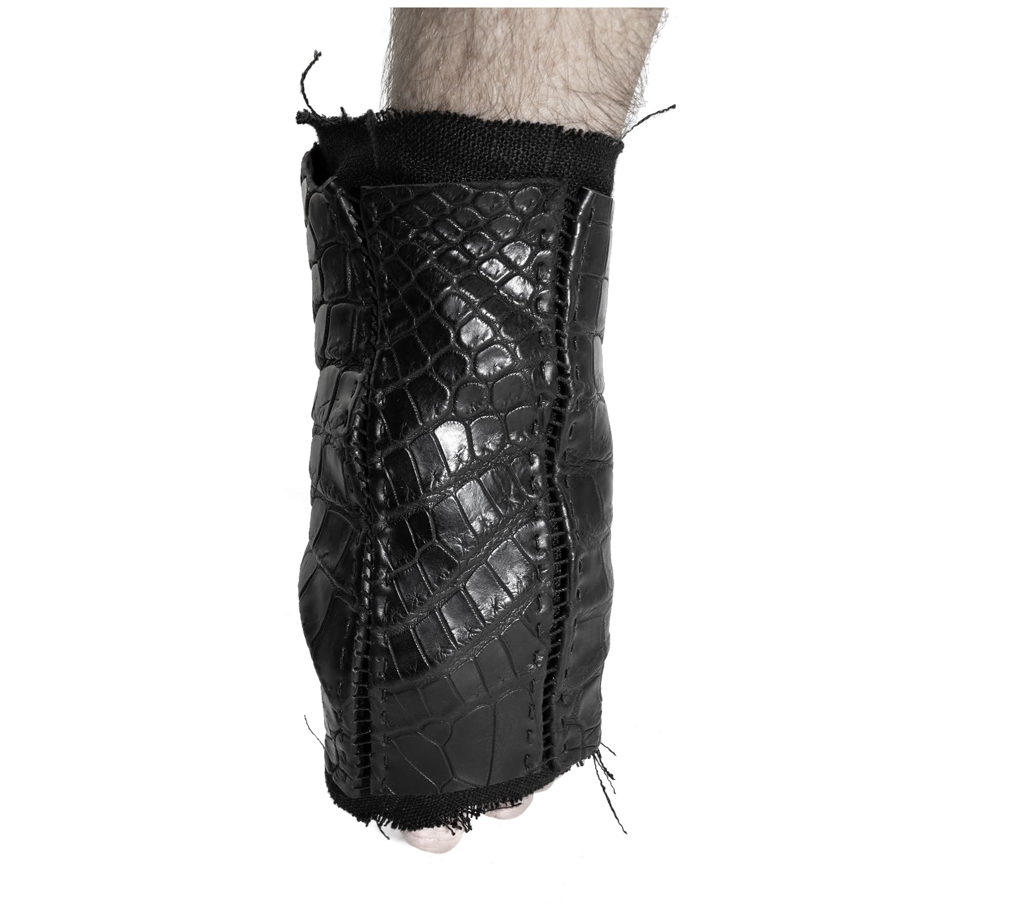 hand stitched over a 40hr period the genuine crocodile leather gloves feature deconstructed open seam panels, and a raw cut vintage french linen lining. with an object dyed finish the gloves are then wet moulded on the body over an 8 hour period for a sculptured aesthetic. the gloves are available to buy online from avant garde leather studio atelierskn.com