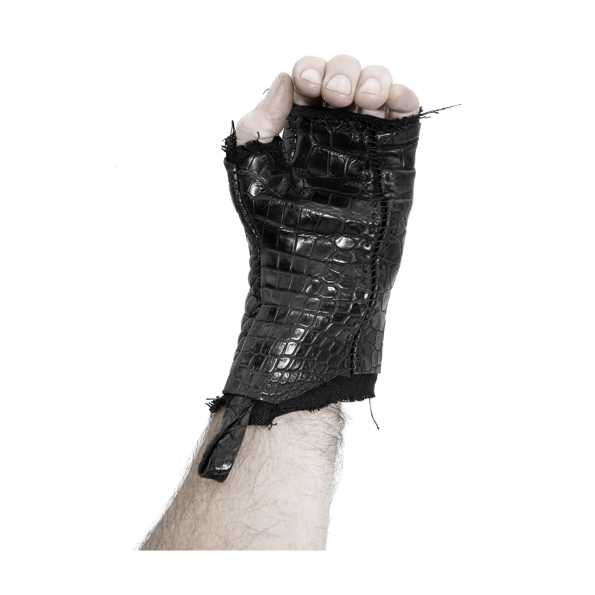 hand stitched over a 40hr period the genuine crocodile leather gloves feature deconstructed open seam panels, and a raw cut vintage french linen lining. with an object dyed finish the gloves are then wet moulded on the body over an 8 hour period for a sculptured aesthetic. the gloves are available to buy online from avant garde leather studio atelierskn.com
