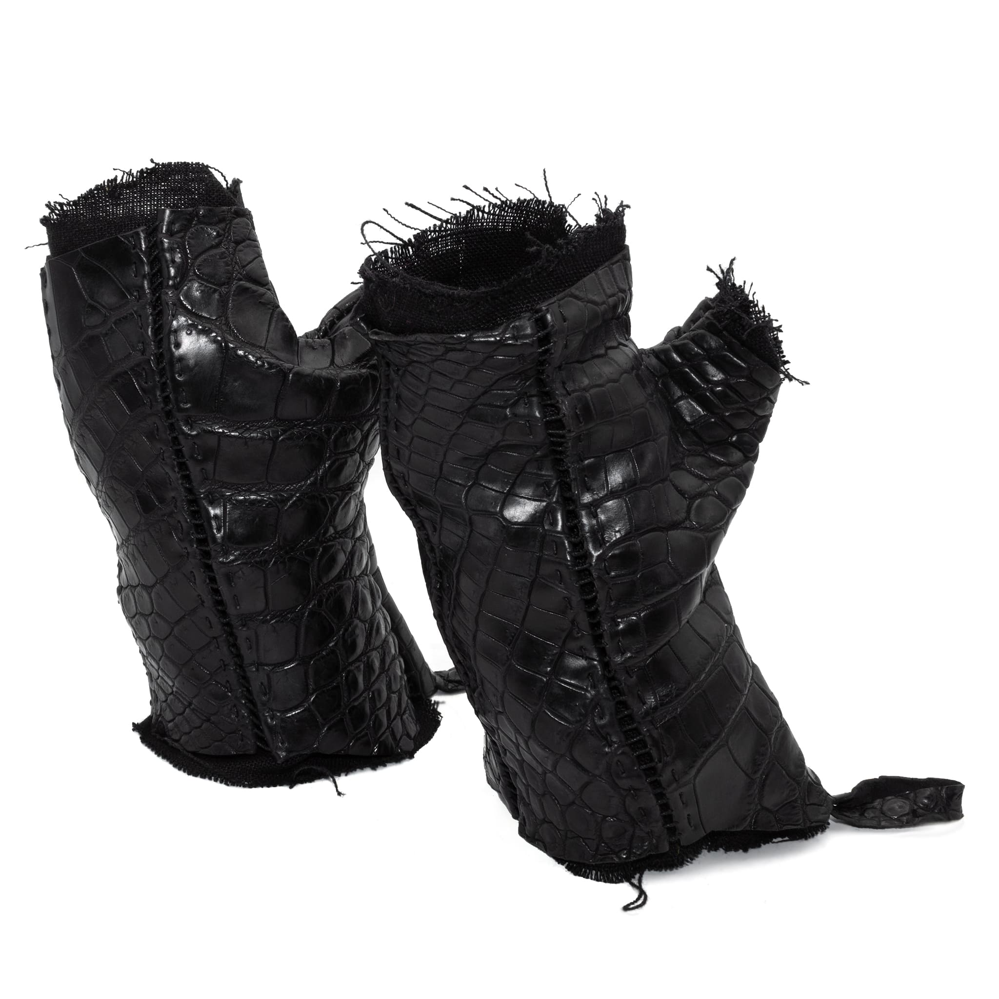 hand stitched over a 40hr period the genuine crocodile leather gloves feature deconstructed open seam panels, and a raw cut vintage french linen lining. with an object dyed finish the gloves are then wet moulded on the body over an 8 hour period for a sculptured aesthetic. the gloves are available to buy online from avant garde leather studio atelierskn.com