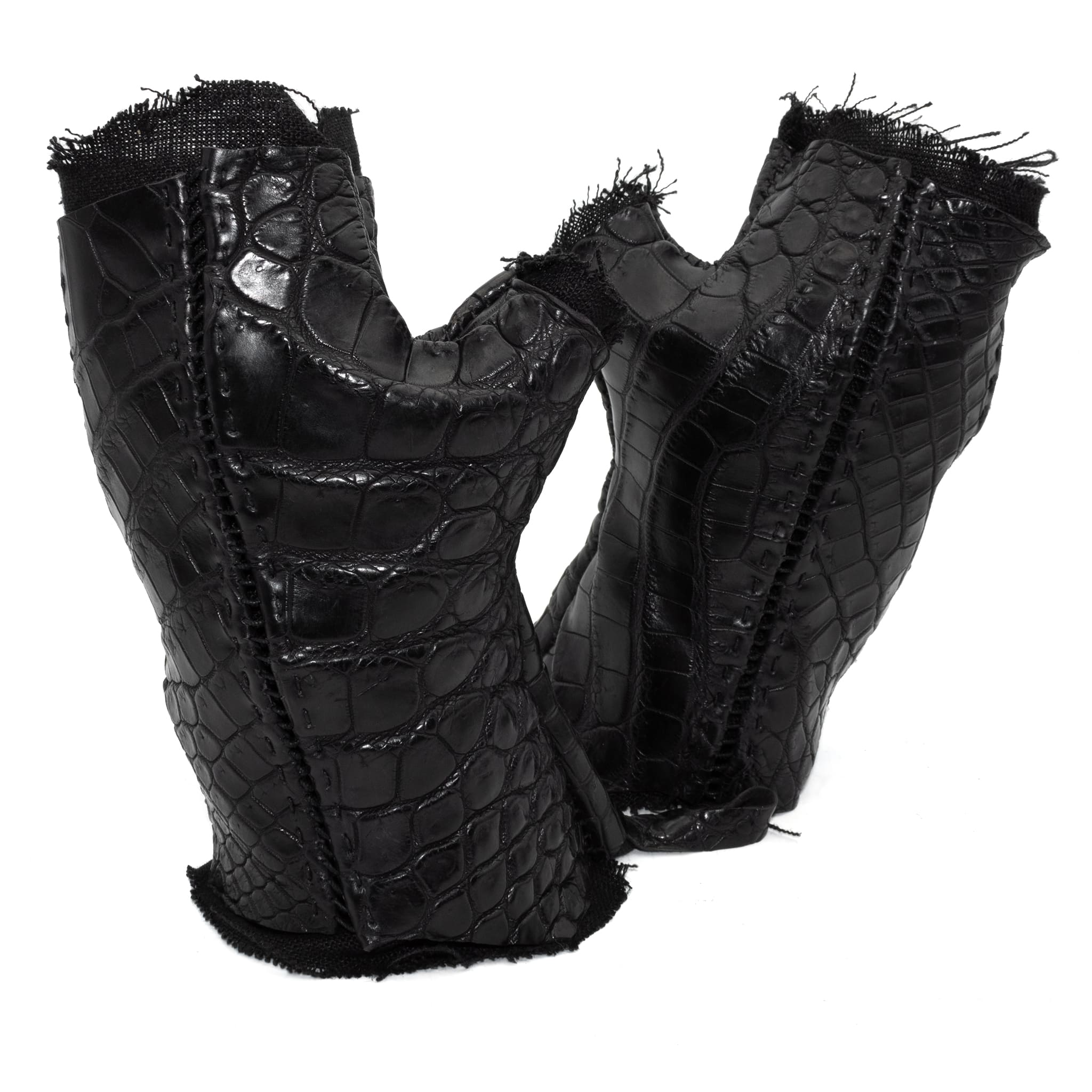 hand stitched over a 40hr period the genuine crocodile leather gloves feature deconstructed open seam panels, and a raw cut vintage french linen lining. with an object dyed finish the gloves are then wet moulded on the body over an 8 hour period for a sculptured aesthetic. the gloves are available to buy online from avant garde leather studio atelierskn.com