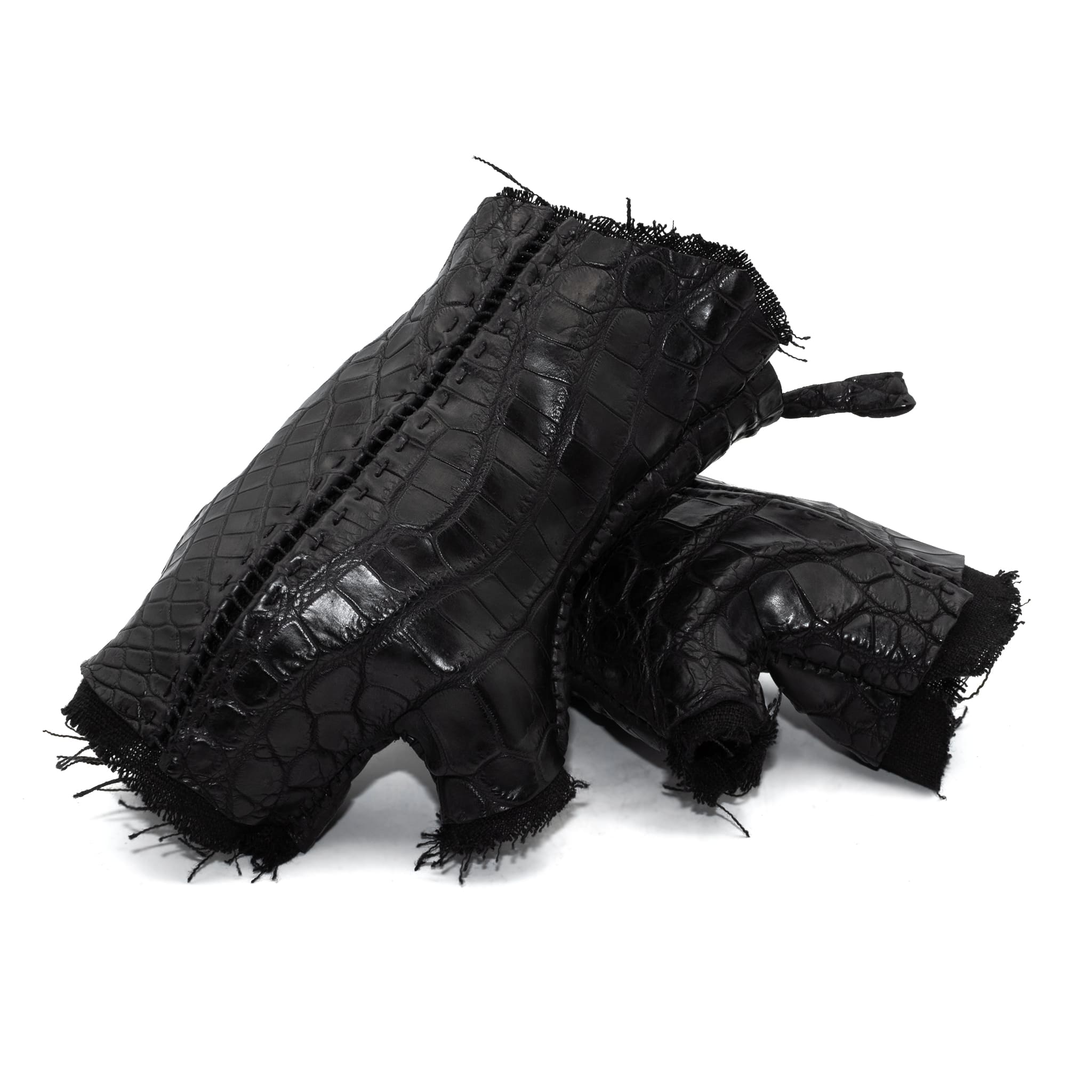 hand stitched over a 40hr period the genuine crocodile leather gloves feature deconstructed open seam panels, and a raw cut vintage french linen lining. with an object dyed finish the gloves are then wet moulded on the body over an 8 hour period for a sculptured aesthetic. the gloves are available to buy online from avant garde leather studio atelierskn.com