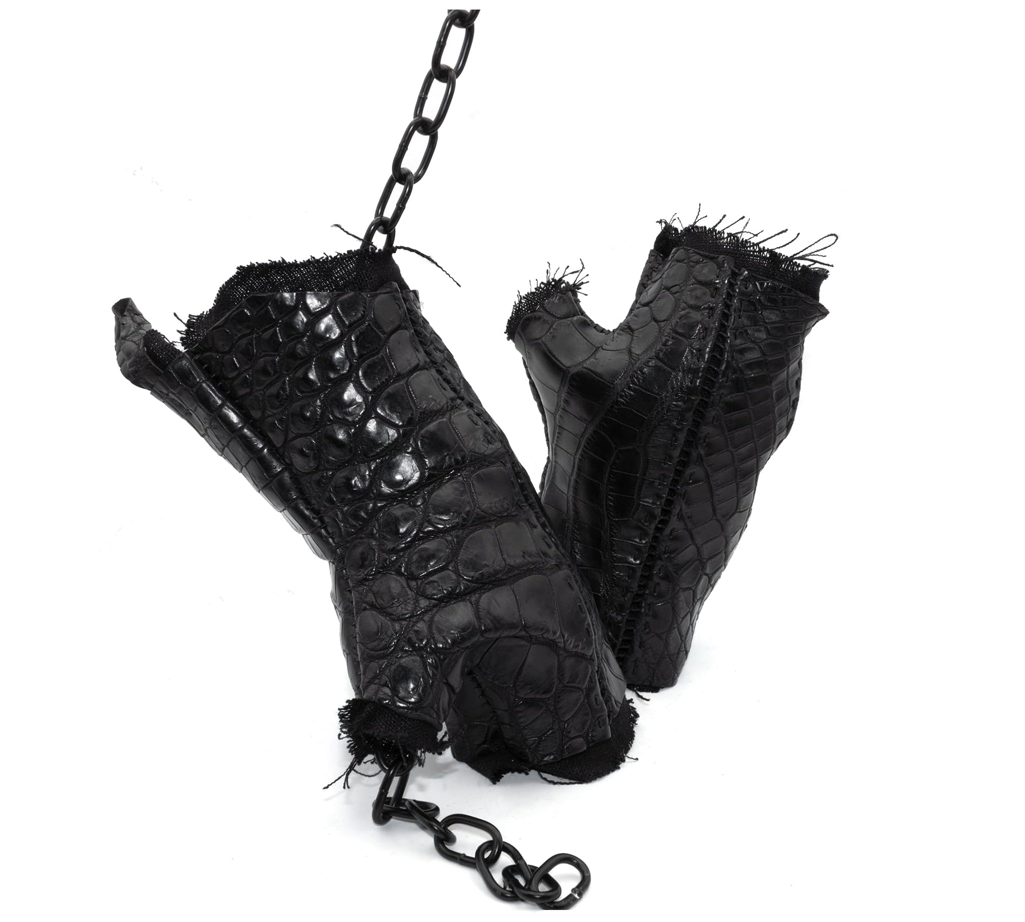 hand stitched over a 40hr period the genuine crocodile leather gloves feature deconstructed open seam panels, and a raw cut vintage french linen lining. with an object dyed finish the gloves are then wet moulded on the body over an 8 hour period for a sculptured aesthetic. the gloves are available to buy online from avant garde leather studio atelierskn.com
