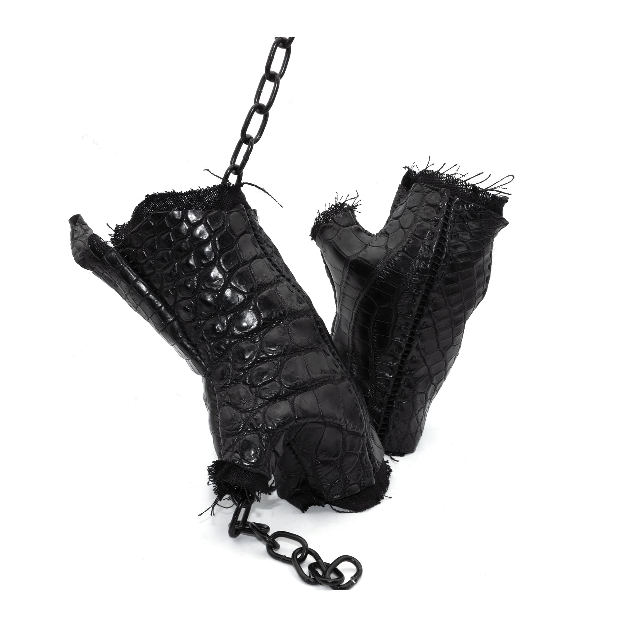 hand stitched over a 40hr period the genuine crocodile leather gloves feature deconstructed open seam panels, and a raw cut vintage french linen lining. with an object dyed finish the gloves are then wet moulded on the body over an 8 hour period for a sculptured aesthetic. the gloves are available to buy online from avant garde leather studio atelierskn.com