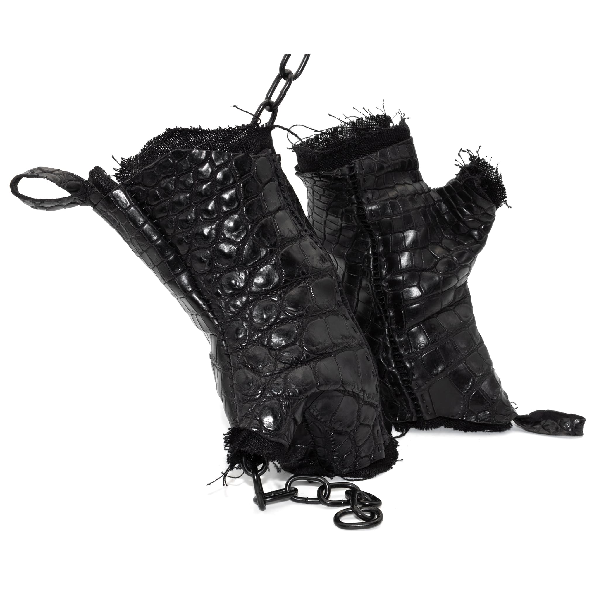 hand stitched over a 40hr period the genuine crocodile leather gloves feature deconstructed open seam panels, and a raw cut vintage french linen lining. with an object dyed finish the gloves are then wet moulded on the body over an 8 hour period for a sculptured aesthetic. the gloves are available to buy online from avant garde leather studio atelierskn.com