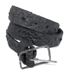 the pyroclastic belt features multiple layers of volcanic ash, sterling silver, burnt bronze layered over 28 days on top of an object dyed matte black full grain reverse horse culatta leather belt. with a hand forged oxidised .925 sterling silver buckle for men and women. expertly hand sewn by independent UK based artisanal designer atelier SKN.