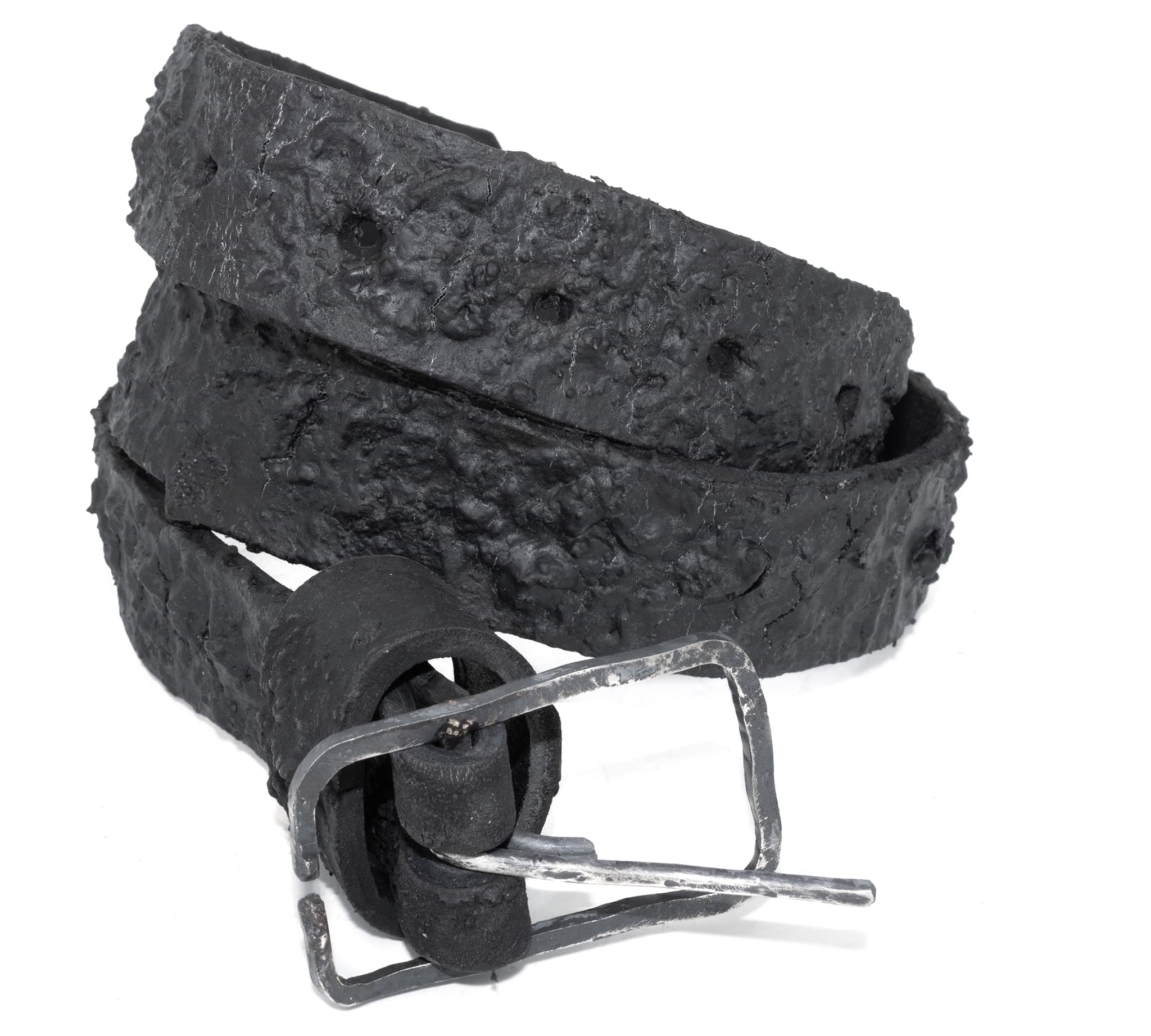 the pyroclastic belt features multiple layers of volcanic ash, sterling silver, burnt bronze layered over 28 days on top of an object dyed matte black full grain reverse horse culatta leather belt. with a hand forged oxidised .925 sterling silver buckle for men and women. expertly hand sewn by independent UK based artisanal designer atelier SKN.
