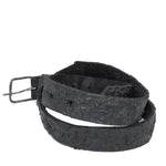the pyroclastic belt features multiple layers of volcanic ash, sterling silver, burnt bronze layered over 28 days on top of an object dyed matte black full grain reverse horse culatta leather belt. with a hand forged oxidised .925 sterling silver buckle for men and women. expertly hand sewn by independent UK based artisanal designer atelier SKN.