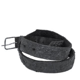 the pyroclastic belt features multiple layers of volcanic ash, sterling silver, burnt bronze layered over 28 days on top of an object dyed matte black full grain reverse horse culatta leather belt. with a hand forged oxidised .925 sterling silver buckle for men and women. expertly hand sewn by independent UK based artisanal designer atelier SKN.