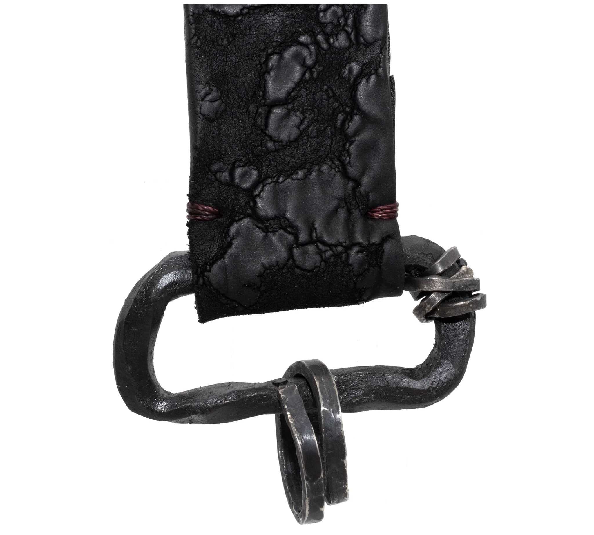 hand stitched with blood dyed thread the black reverse horse culatta leather keychain features a military clip and hand forged iron hardware with .925 sterling silver details.