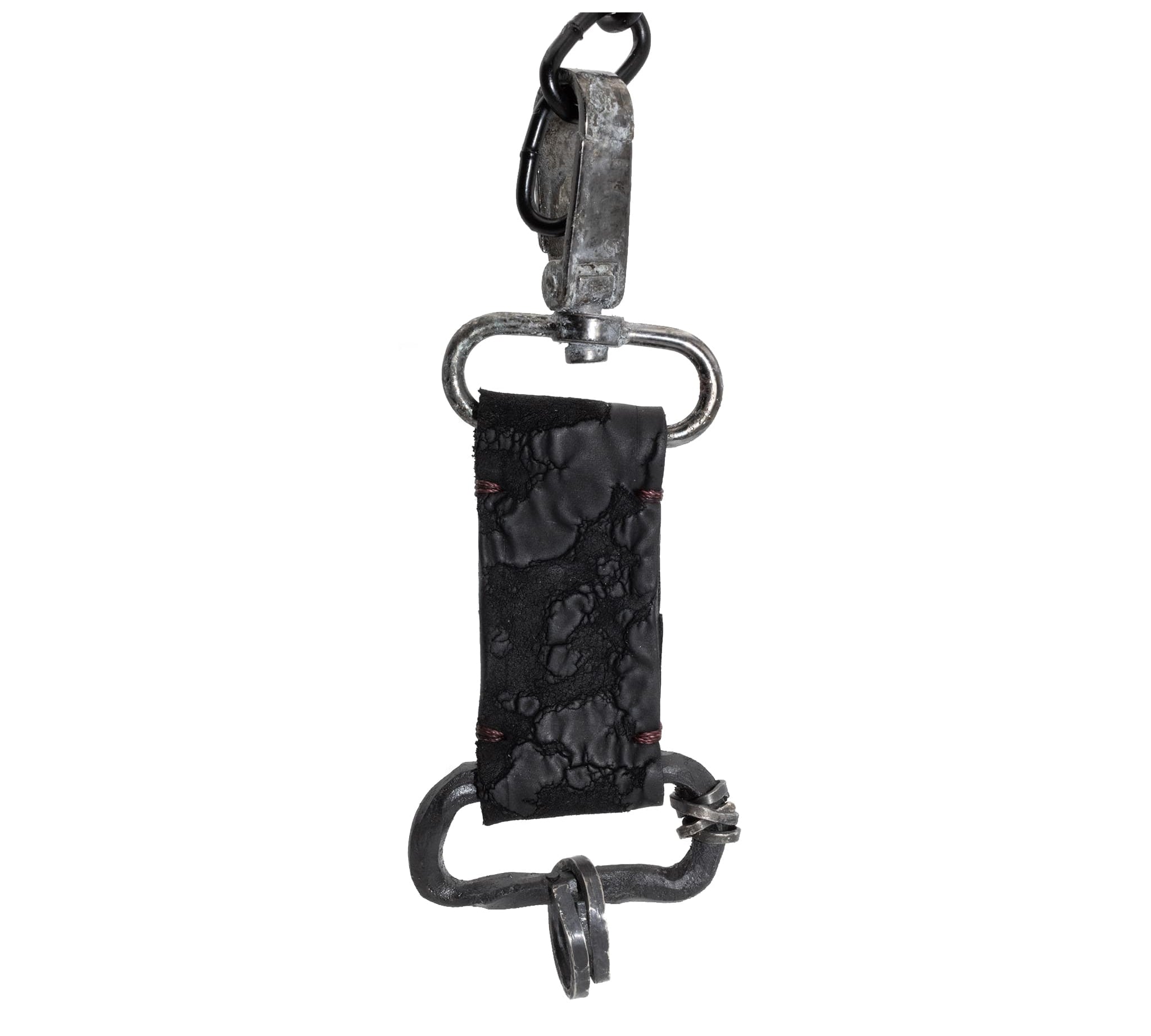 hand stitched with blood dyed thread the black reverse horse culatta leather keychain features a military clip and hand forged iron hardware with .925 sterling silver details.
