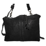 hand stitched over a 50hr period the washed cordovan shoulder bag features an open seam construction, hand forged iron hardware and a riri zipper closure adorned with solid .925 sterling silver zipper pulls. the bag is available to buy online from avant garde leather studio atelierskn.com