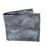 a closed seam 6 pocket bifold wallet crafted from a supple matte black kangaroo leather with a contrasting pigmented wax finish available to buy online from artisanal leather studio atelierskn.com