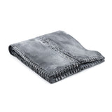 a closed seam 6 pocket bifold wallet crafted from a supple matte black kangaroo leather with a contrasting pigmented wax finish available to buy online from artisanal leather studio atelierskn.com