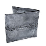 a closed seam 6 pocket bifold wallet crafted from a supple matte black kangaroo leather with a contrasting pigmented wax finish available to buy online from artisanal leather studio atelierskn.com